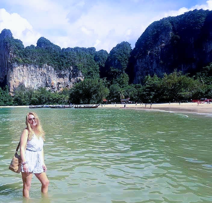 Guest at Railay Beach limestone cliffs